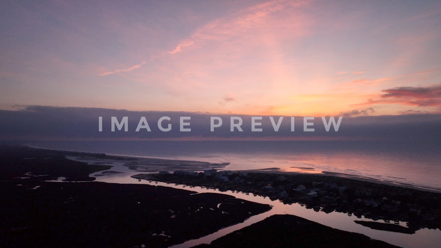 4k Still Frame - Sunsrise over the ocean with beautiful morning sky and beach houses at Pawleys Island, SC