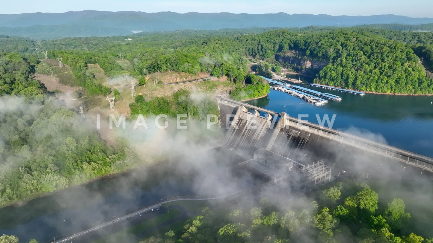stock photo morning fog over Norris Dam in tennessee mountains