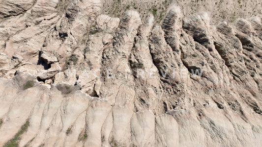 4k Still Frame - Badlands, South Dakota looking down at erosion at bottom of Butte