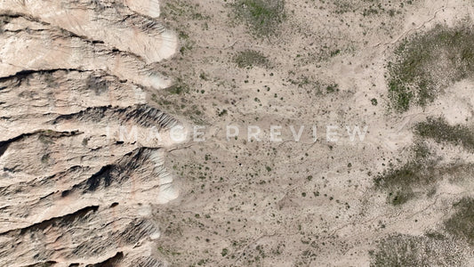 4k Still Frame - Badlands, South Dakota looking down at sedimentation deposits from Butte erosion
