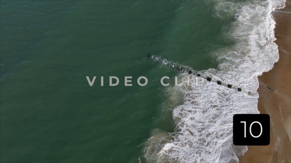 CLIP 10 - Outer Banks, NC looking down on breaking waves with person on beach