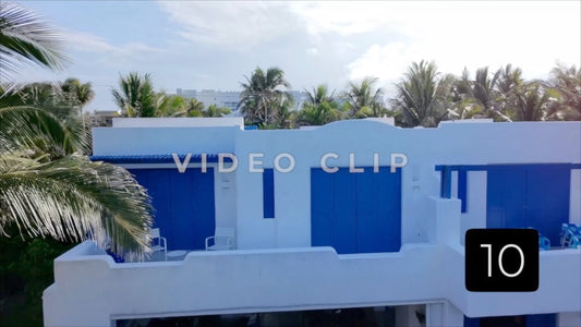 CLIP 10 - Isla Mujeras, Mexico low flight over resort villas and over road