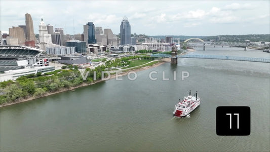 CLIP 11 - Cincinnati, Ohio city skyline view from Ohio river with riverboat passing by