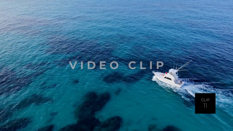CLIP 11 - Isla Mujeras, Mexico fishing boat cruising over clear Caribbean water