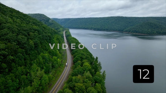 CLIP 12 - Cars traveling past mountain range and Kinzua Dam reservoir in Allegheny National Forest