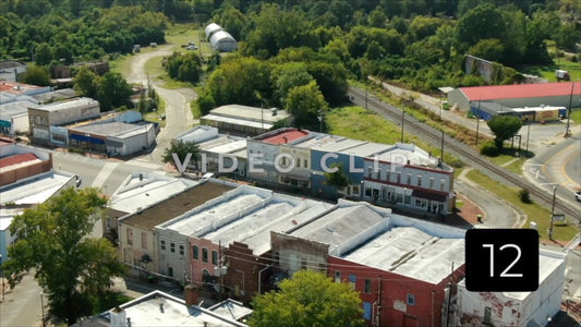 CLIP 12 - Montezuma, GA flying towards downtown with Post Office is foreground