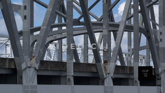 CLIP 12- New Orleans, LA rust on Crescent City Connection Bridge as cars drive past