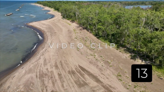 CLIP 13 - Erie, PA Presque Isle State Park view of remote beach with people walking by Lake Erie