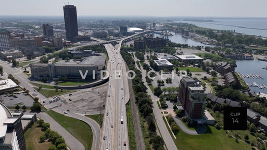 CLIP 14 - Buffalo, NY drone flight over interstate highway with cars traveling past Lake Erie