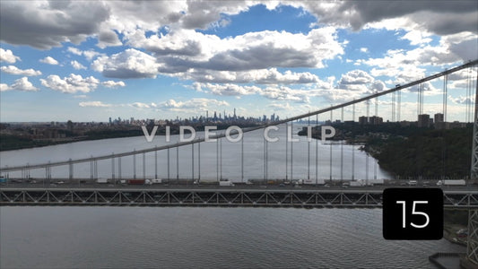 CLIP 15 - New York, NY Vol 1. - cars crossing Hudson River on George Washington Bridge with city skyline on horizon
