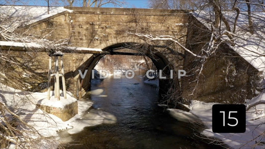 CLIP 15 - Winter Vol. 5 - Arched stone train bridge over gentle running creek