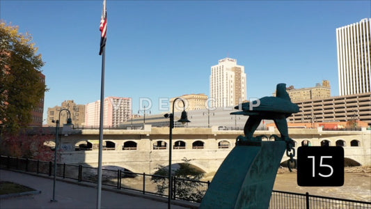 CLIP 15 - Rochester, NY Vol. 1 - view of city buildings downtown across the Genesee River from Blue Cross Arena memorial park