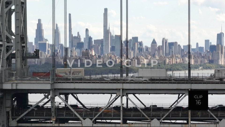 CLIP 16 - New York, NY close view of George Washington Bridge with traffic and biker