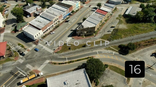 CLIP 16 - Montezuma, GA flight over downtown buildings and streets with light traffic
