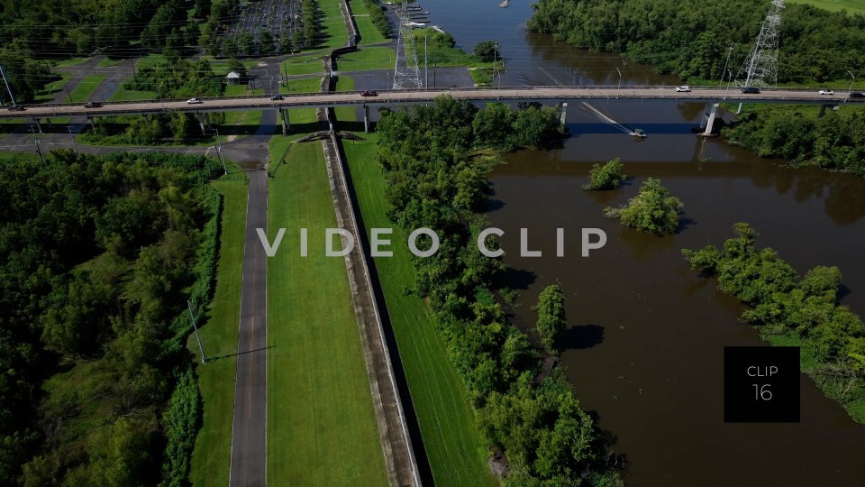 CLIP 16 - New Orleans, LA Aerial following Flood wall beside bayou