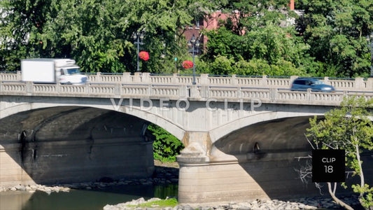 CLIP 18 - Binghamton, NY traffic crossing arched bridge over Chenango River downtown