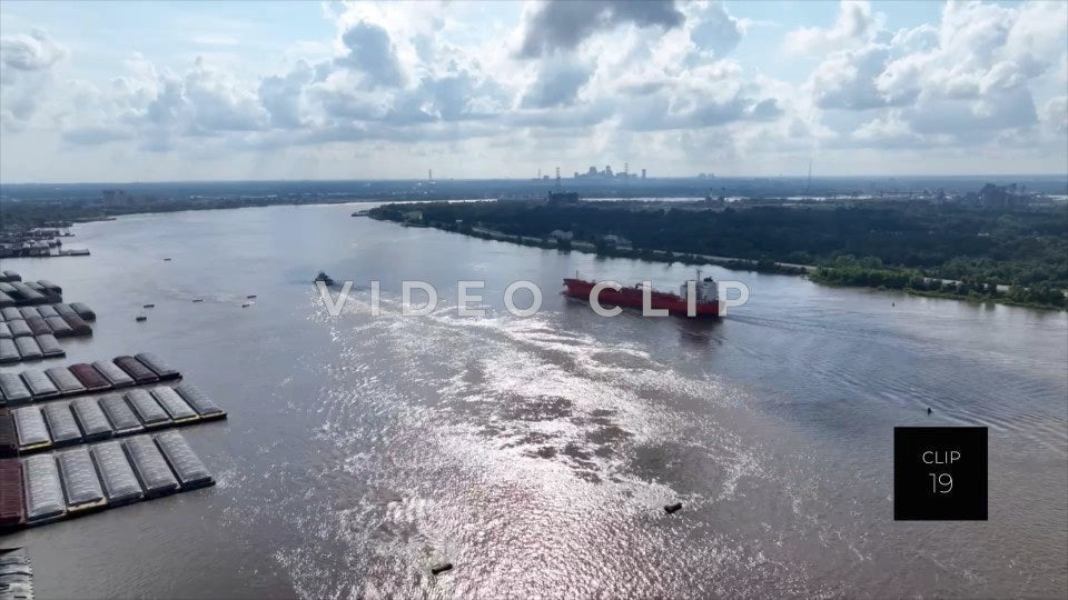 CLIP 19 - New Orleans, LA morning light on Mississippi River with cargo ship