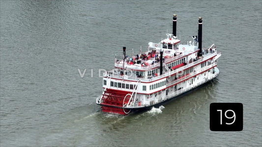 CLIP 19 - Cincinnati, Ohio zoom view of Belle of Cincinnati riverboat traveling up Ohio river
