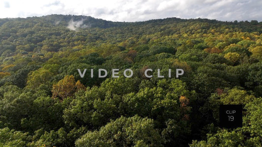 CLIP 19 - Ohiopyle, PA rising up slowly past trees to reveal mountain landscape with mist