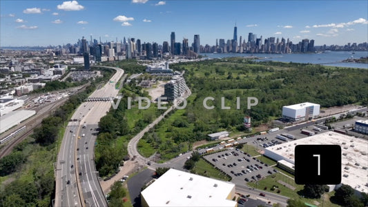 CLIP 1 - New York, NY Vol 2. - Aerial view from above interstate traffic heading to NY and New Jersey past Liberty Park