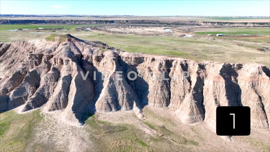 CLIP 1 - Badlands, SD close drone flight over Butte on mixed grass prairie