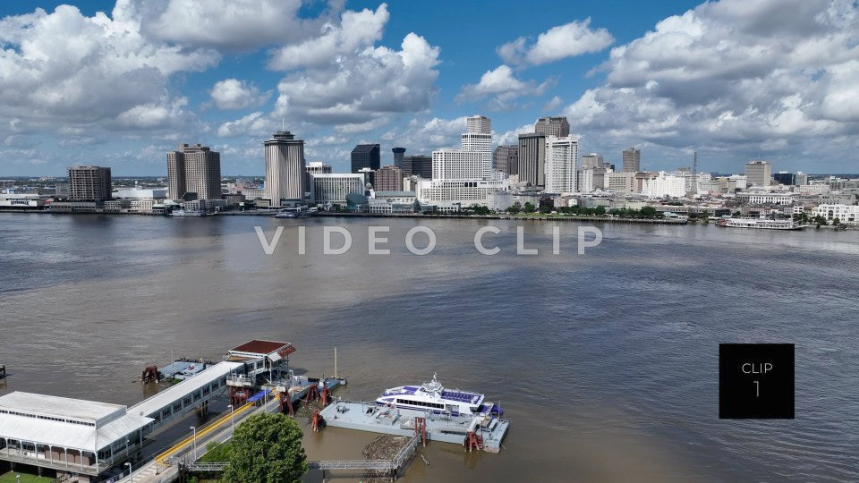 CLIP 1 - New Orleans, LA rising up over Mississippi river to city skyline