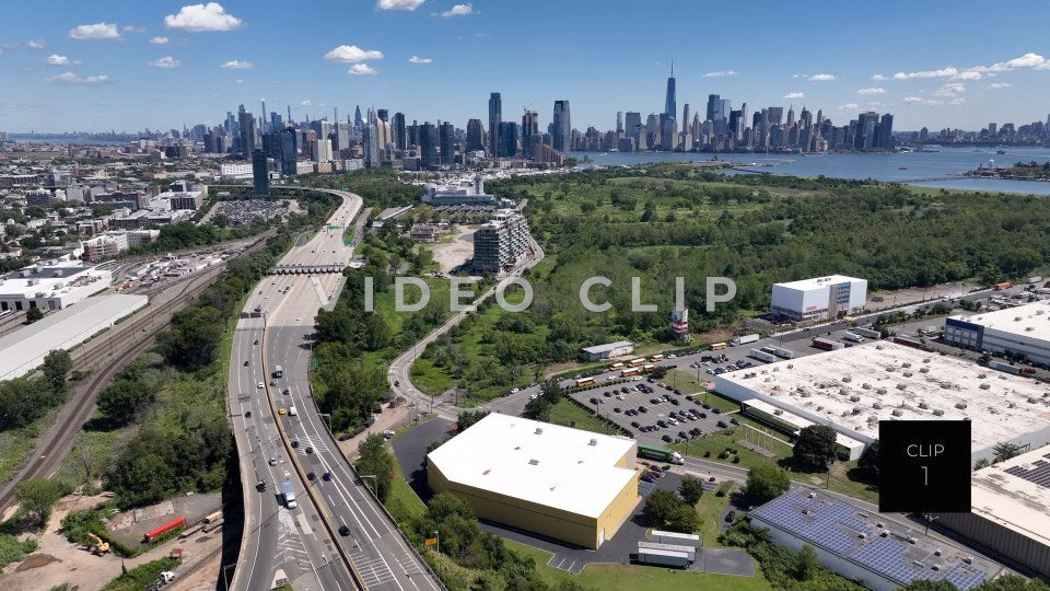 CLIP 1 - New York, NY Aerial view from above interstate traffic heading to NY and New Jersey past Liberty Park