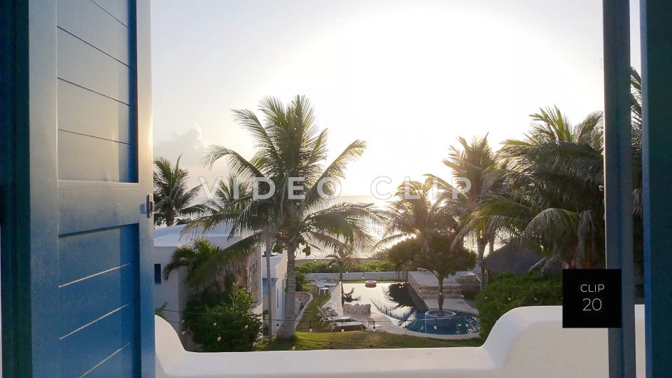 CLIP 20 - Isla Mujeras, Mexico slow flight through windows to sunrise over ocean
