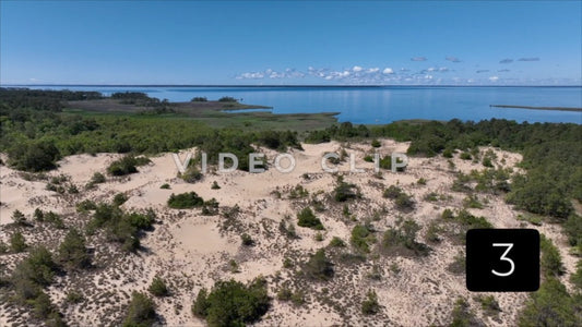 CLIP 3 - Outer Banks, NC aerial of natural sand dunes by inlet