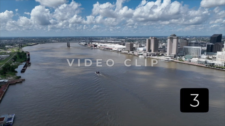 CLIP 3 - New Orleans, LA Vol. 2 - tug boat motoring up Mississippi River past downtown