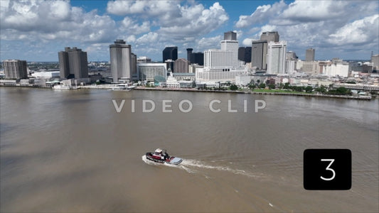 CLIP 3 - New Orleans, LA Vol. 1 - tug boat on Mississippi river passing by city skyline