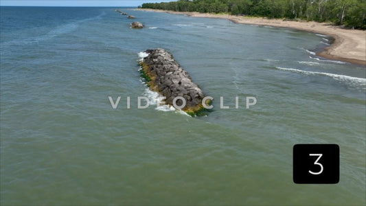 CLIP 3 - Erie, PA Presque Isle State Park low flight over rocky jetties that protect shoreline from erosion