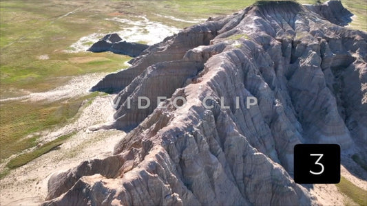 CLIP 3 - Badlands, SD dramatic flight towards Butte then lowering to far side
