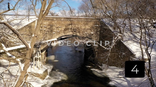 CLIP 4 - Winter Vol. 5 - Snow covered train bridge with stone arch in Winter