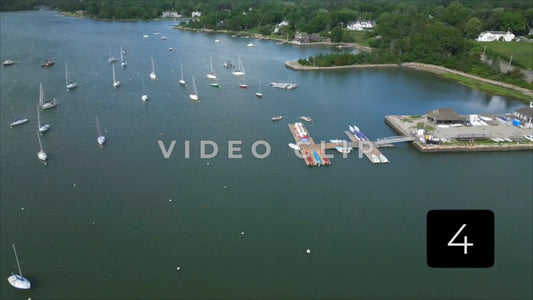 CLIP 4 - Boston, MA small boats leaving marina near harbor coastline