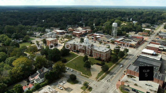 CLIP 5 - Eatonton, GA  - Putnam County Clerk of Courts - aerial rising above downtown and flying towards horizon