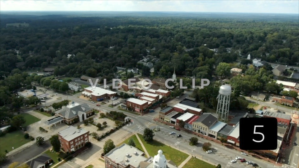 CLIP 5 - Eatonton, GA - Putnam County Clerk of Courts - aerial rising above downtown and flying towards horizon
