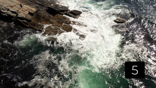 CLIP 5 - Maine Coast looking down on ocean waves breaking on rocks