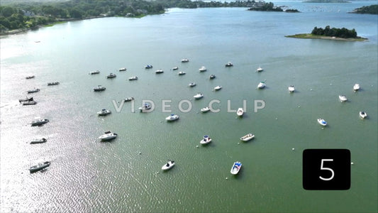 CLIP 5 - Boston, MA boats moored in harbor in late afternoon sunshine with view of islands