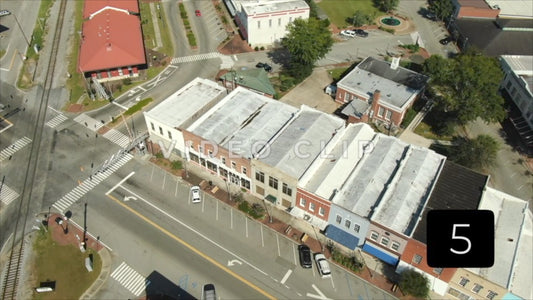 CLIP 5 - Montezuma, GA cars driving through intersection beside train depot