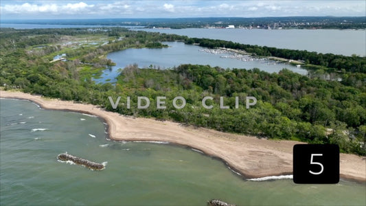 CLIP 5 - Erie, PA Presque Isle State Park aerial pulling away over Lake Erie with view of marina