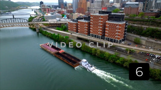 CLIP 6 - Pittsburgh, PA Vol. 2 - barges traveling past city skyline toward bridges