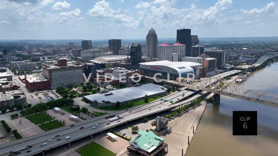 CLIP 6 - Louisville, KY cars and truck driving past downtown beside Ohio River