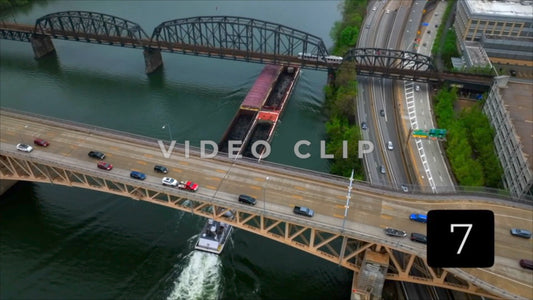 CLIP 7 - Pittsburgh, PA Vol. 2 - barges traveling under bridges with cars and city transit