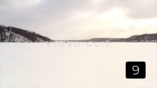 CLIP 9 - Winter Vol. 3 - Winter frozen Irondequoit Bay with ice fisherman and bridge crossing