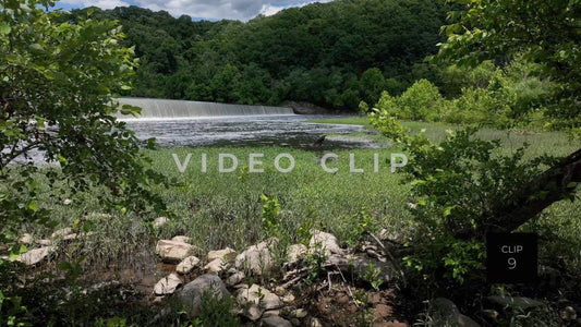 CLIP 9 - Lynchburg, VA green grassy shoreline below waterfall dam