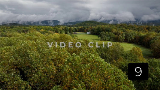 CLIP 9 - Ohiopyle, PA treetop flying towards homestead as clouds pass low over mountain top