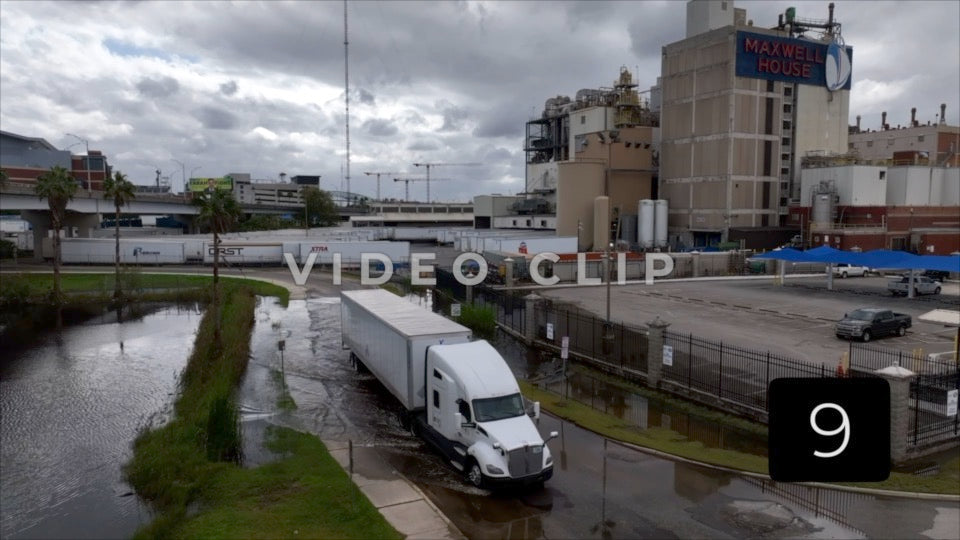 CLIP 9 - Jacksonville, FL truck drives through flooded street past Maxwell Coffee factory