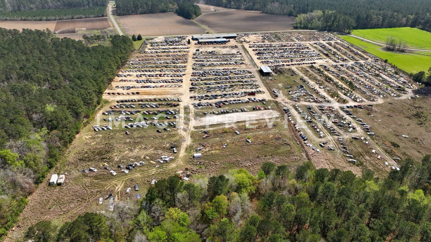 4k Still Frame - Hemingway, SC aerial view of junkyard cars