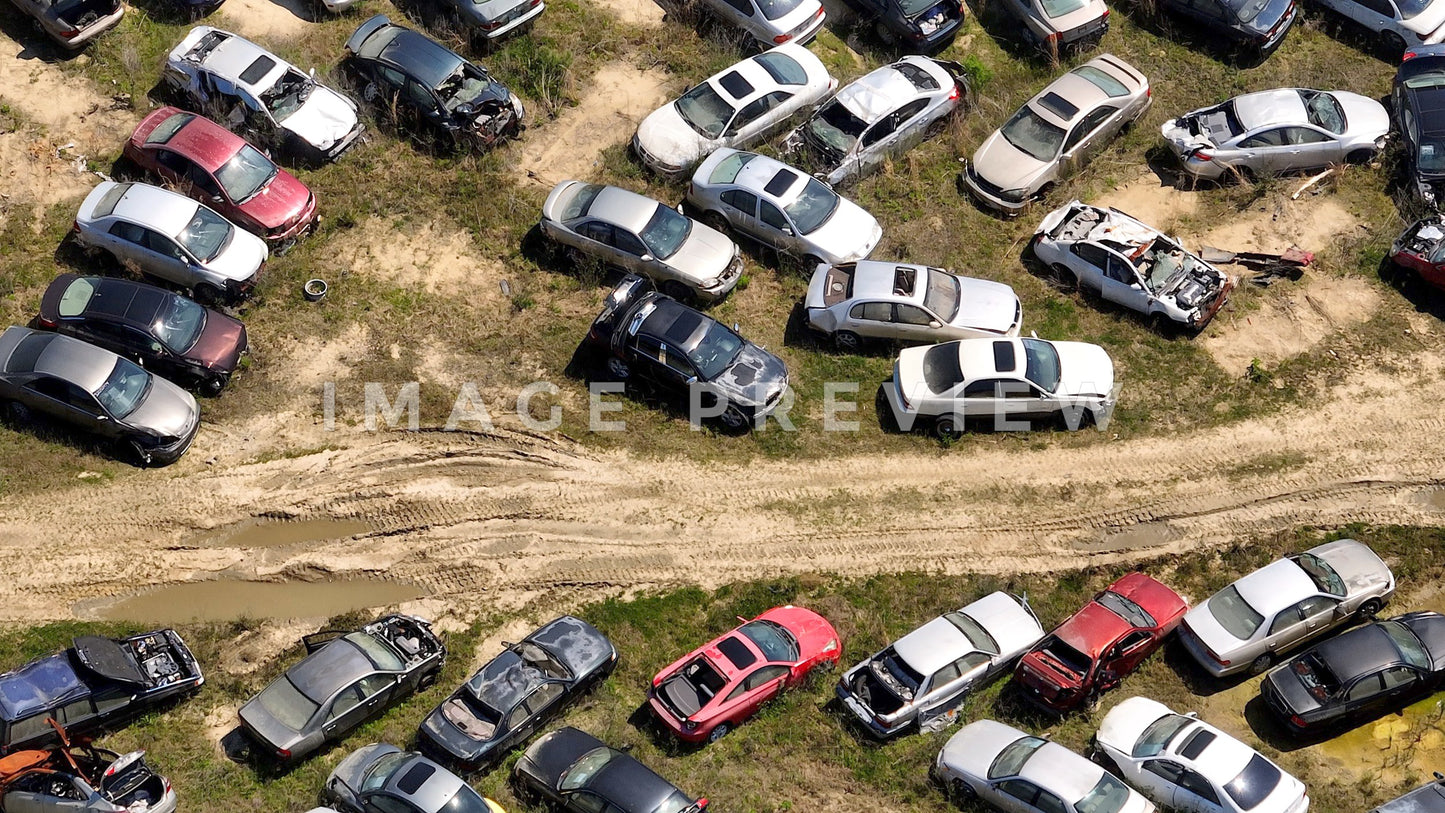 4k Still Frame - Hemingway, SC abandoned cars in junkyard with dirt road